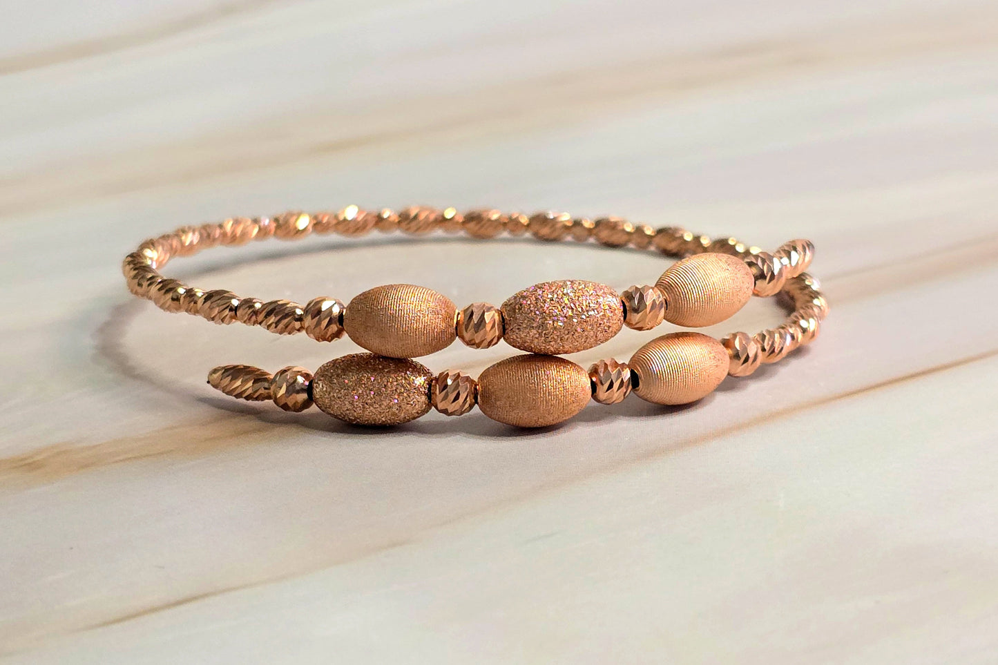 Twisted Rope Bangle — Oval Bead Accent in Rose Gold-Plated Silver