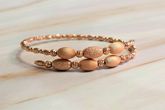 Twisted Rope Bangle — Oval Bead Accent in Rose Gold-Plated Silver